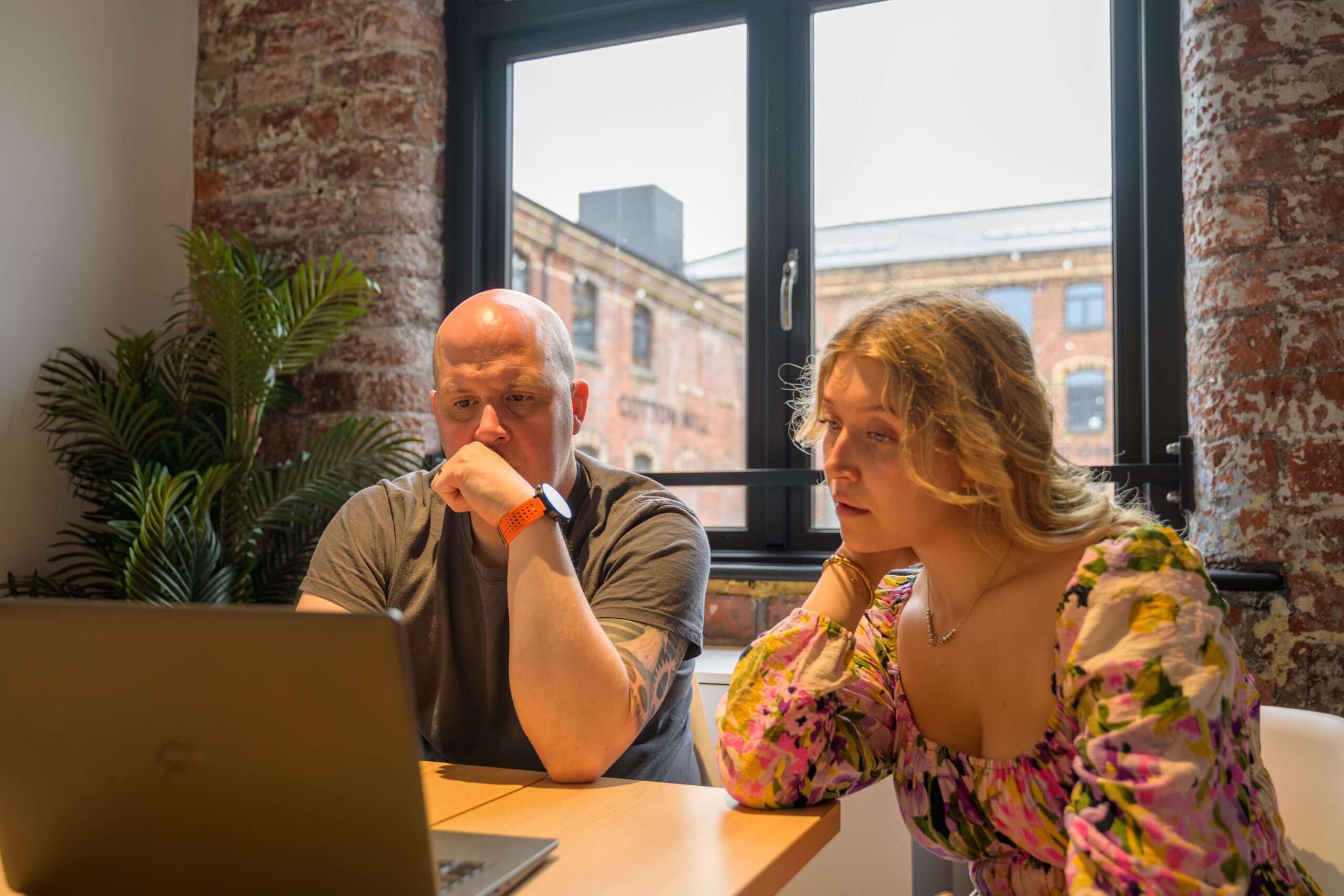 Logica team analysing data on computer for digital marketing reporting